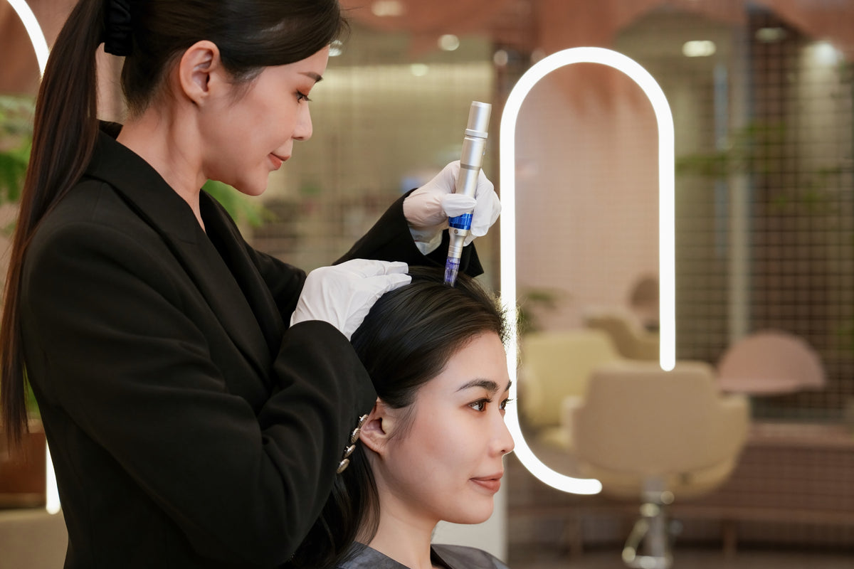 A TrichoLab scalp specialist treating a client in the Wheelock Place boutique