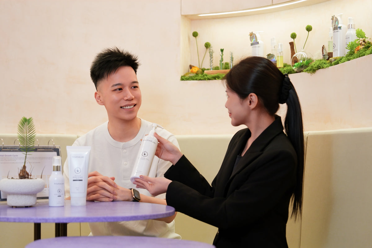 A TrichoLab specialist introducing hair care products at the Wheelock Place boutique