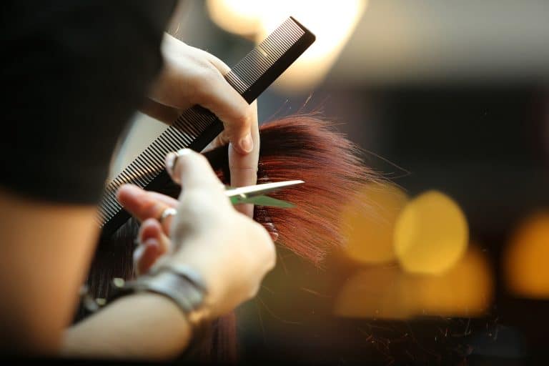 a hair stylist cutting hair