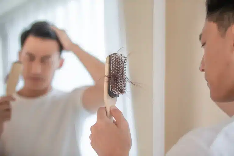 Man upset over shedding hair on hairbrush